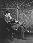 Nikola Tesla, with Rudjer Boscovich's book "Theoria Philosophiae Naturalis", in front of the spiral coil of his high-voltage Tesla coil transformer at his East Houston St., New York, laboratory.