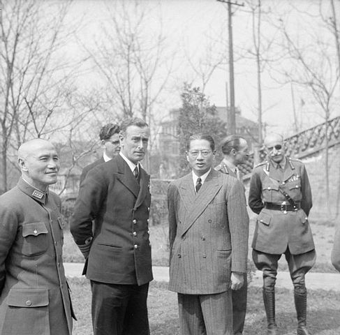 Admiral of the Fleet Earl Mountbatten of Burma Supreme Allied Commander South East Asia: Mountbatten with General Chiang Kai-Shek (left) and Dr T V Soong (right). In the background are Captain R V Brockman, Lt Gen F A M Browning and General Carton de Wiart VC at Chungking.