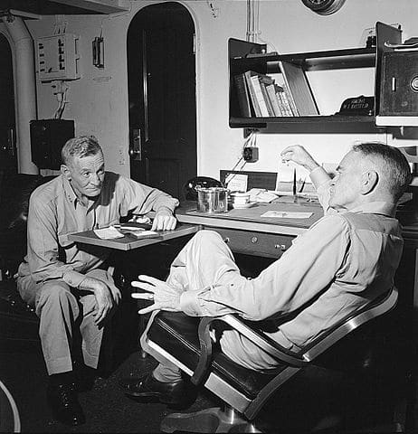 Vice Adm. John S. McCain (left) and Adm. William F. Halsey, Com. 3rd Flt., hold conference on board USS New Jersey (BB-62) en route to the Philippines.