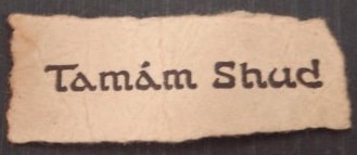 As quoted in the Smithsonian article regarding the two printed words shown: "The scrap of paper discovered in a concealed pocket in the dead man's trousers. 'Tamám shud' is a Persian phrase; it means 'It is ended.' The words had been torn from a rare New Zealand edition of The Rubaiyat of Omar Khayyam." [dating to the 12th century]