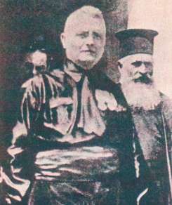 The prefect Cesare Mori in a black shirt at Piana degli Albanesi, an Albanian community of Byzantine rite in Sicily (see papas behind).