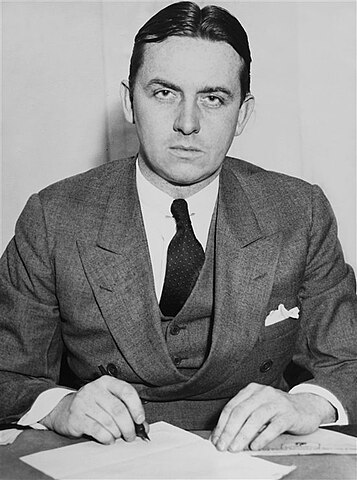 Photograph of American Prohibition agent, Eliot Ness, this in 1931 while at his office with his police duties.