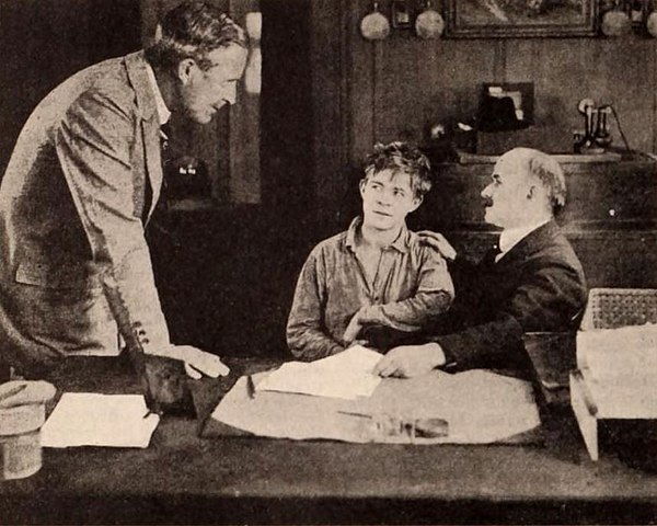 Still from the American drama film The Soul of Youth (1920) under its working title The Boy with film director William Desmond Taylor, Lewis Sargent, and jurist Benjamin Barr Lindsey, on page 50 of the May 22, 1920 Exhibitors Herald.